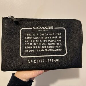COACH Black Canvas Zip Pouch with White Storypatch Text